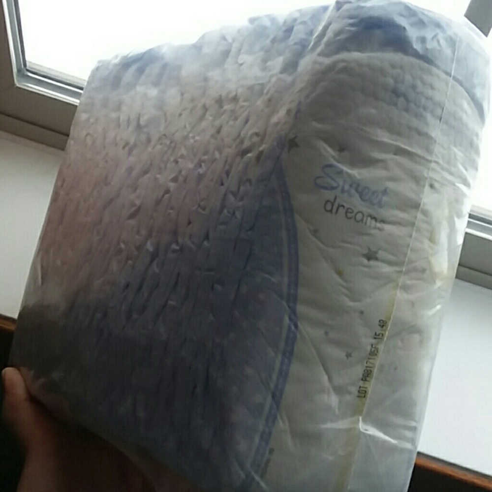 Unopened package of night time diapers